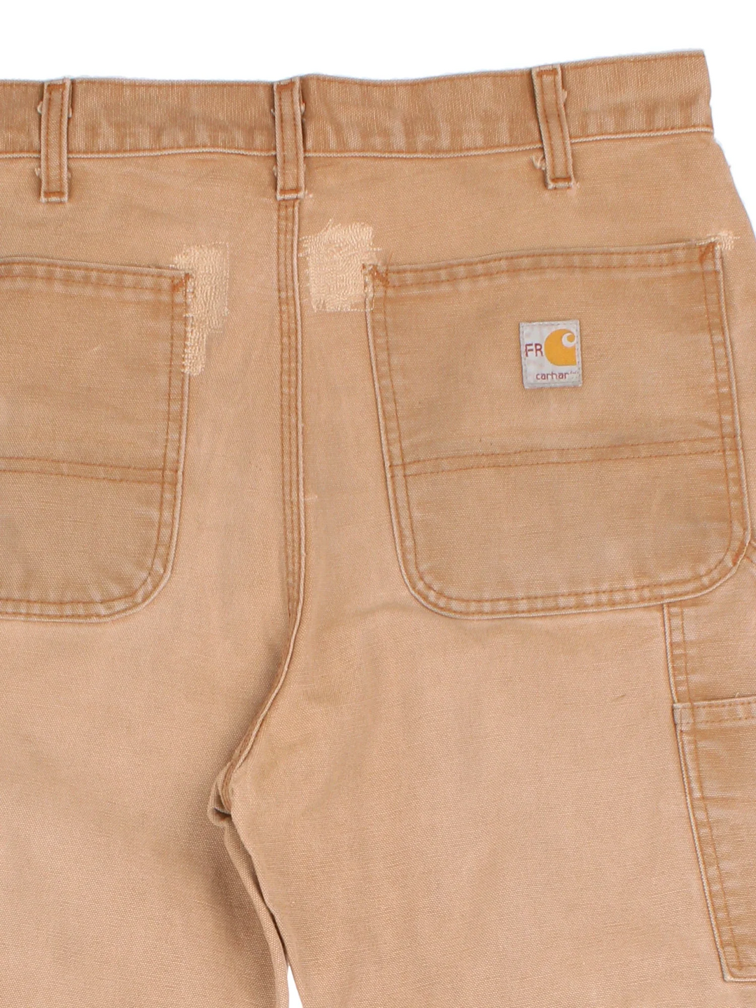 Carhartt Carpenter Jeans in a tan colourway with multiple pockets and the logo embroidered on the back.