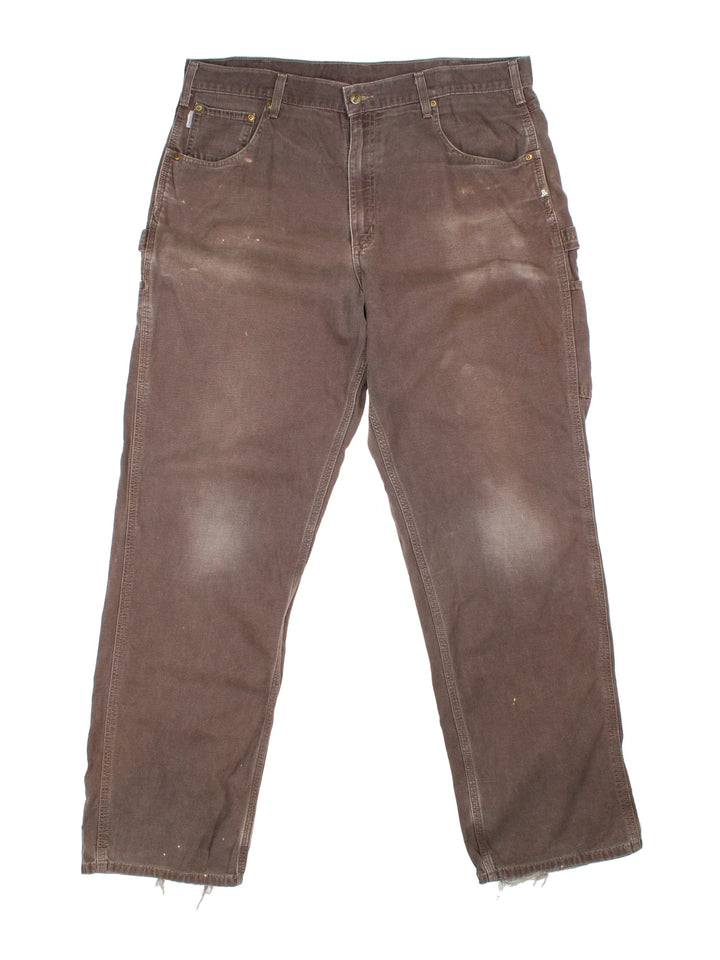 Carhartt Carpenter Jeans in a brown colourway with multiple pockets and the logo embroidered on the back.