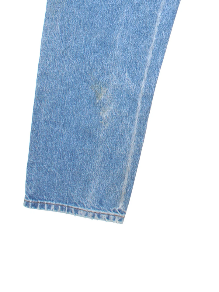 Carhartt Jeans in a blue colourway with multiple pockets and the logo embroidered on the back.
