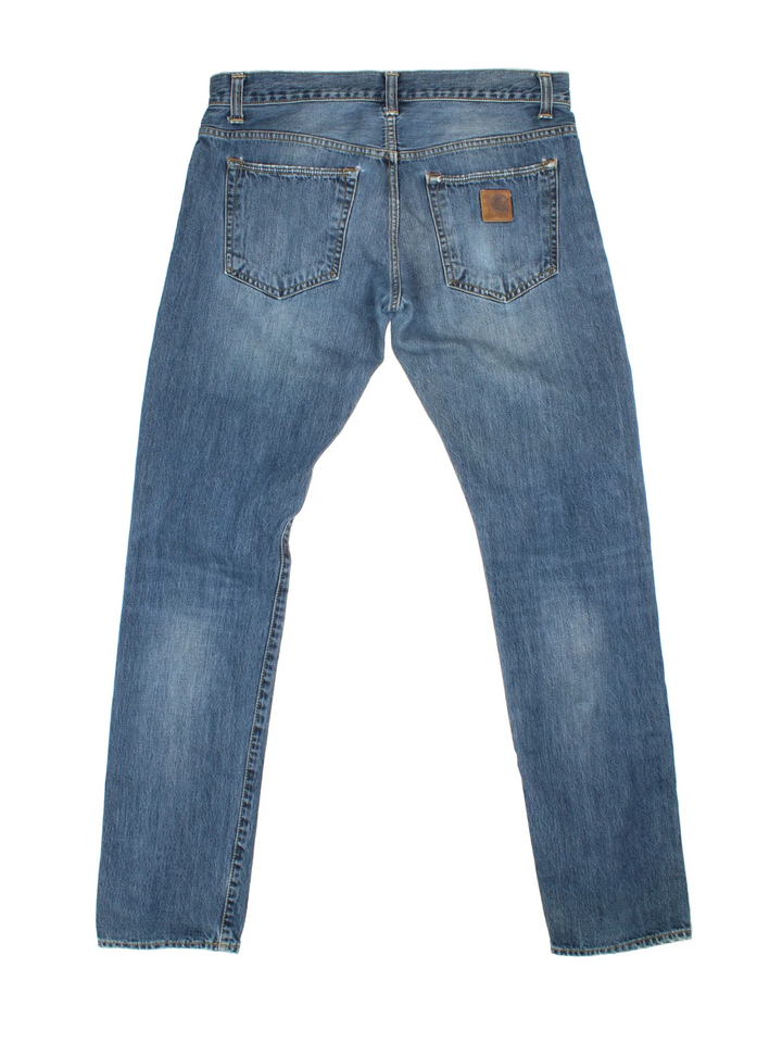 Carhartt Jeans in a blue colourway with multiple pockets and the logo embroidered on the back.