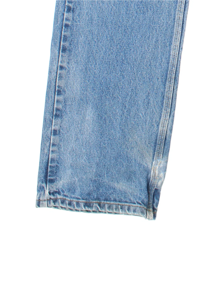 Carhartt Jeans in a blue colourway with multiple pockets and the logo embroidered on the back.