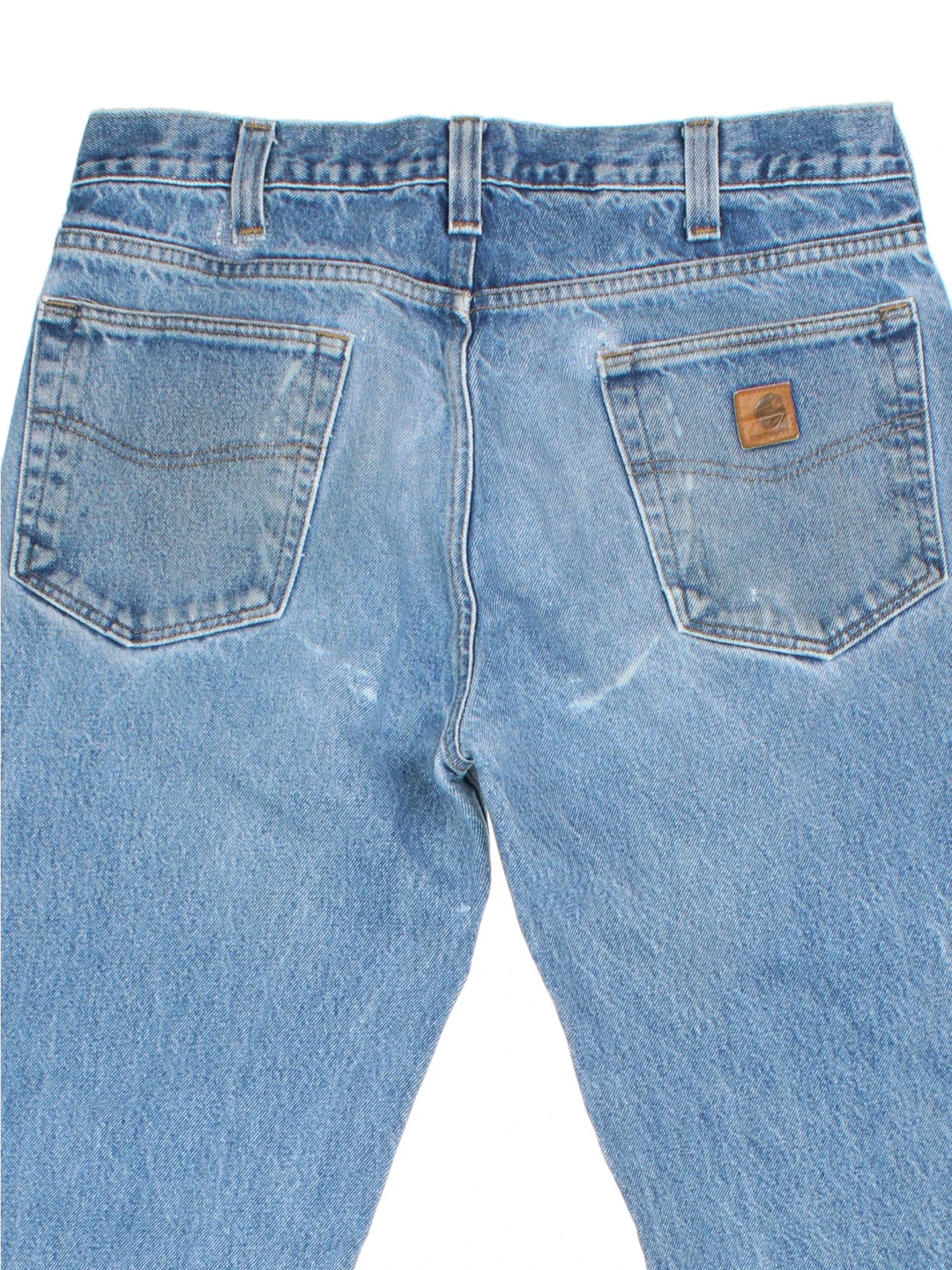 Carhartt Jeans in a blue colourway with multiple pockets and the logo embroidered on the back.