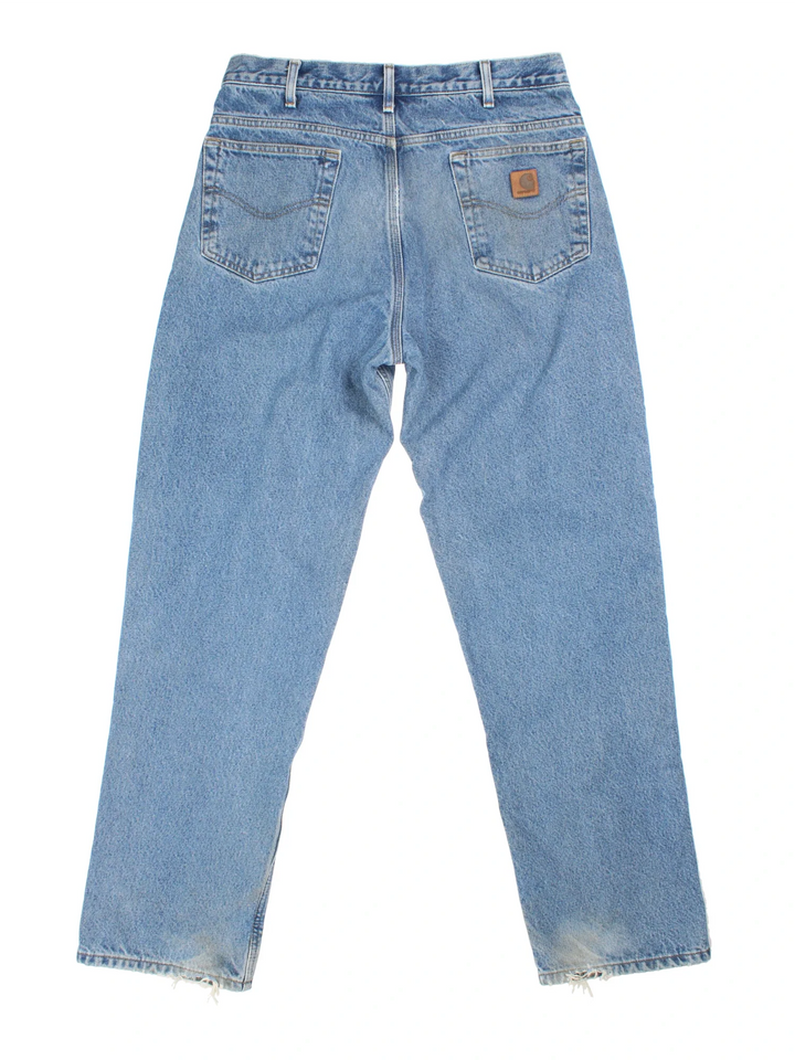 Carhartt Jeans in a blue colourway with multiple pockets, checked lining and the logo embroidered on the back.