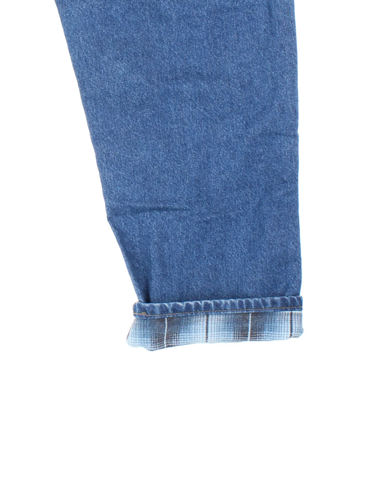 Carhartt Jeans in a blue colourway with multiple pockets, checked lining and the logo embroidered on the back.