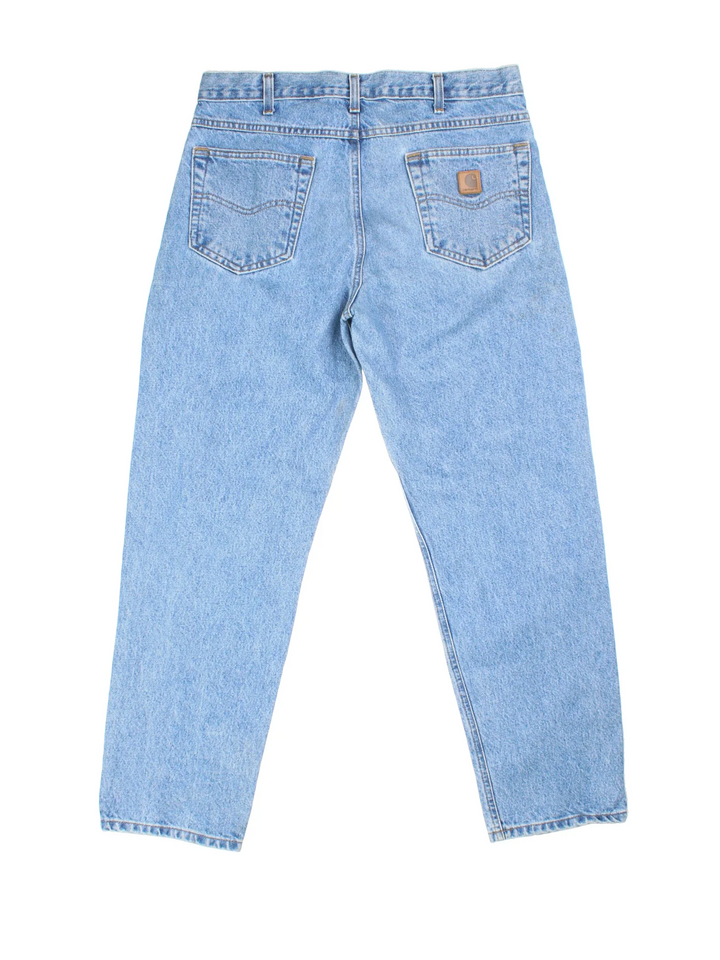 Carhartt Jeans in a blue colourway with multiple pockets and the logo embroidered on the back.