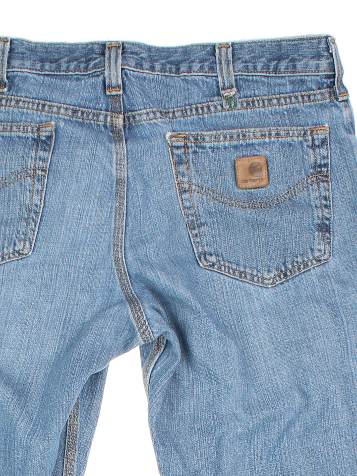 Carhartt Jeans in a blue colourway with multiple pockets and the logo embroidered on the back.