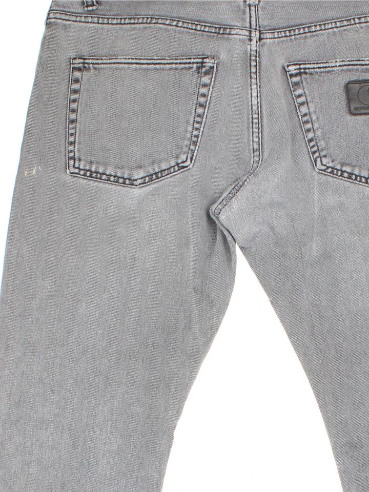 Carhartt Jeans in a grey colourway with multiple pockets and the logo embroidered on the back.