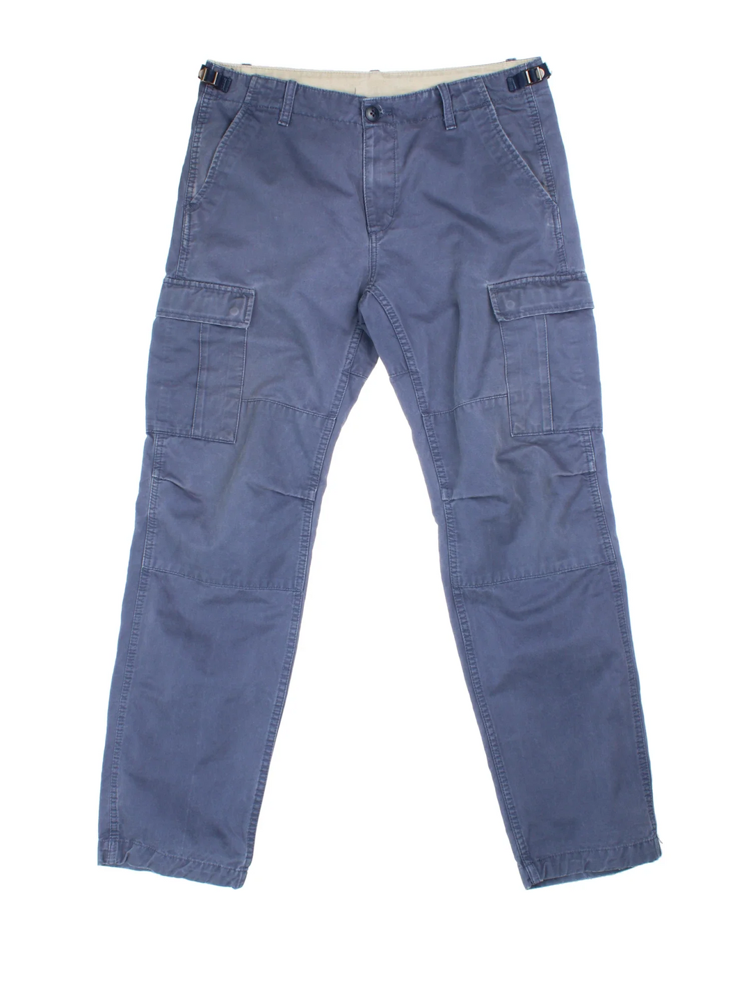 Carhartt Cargo Trousers in a blue colourway with multiple pockets and the logo embroidered on the back.