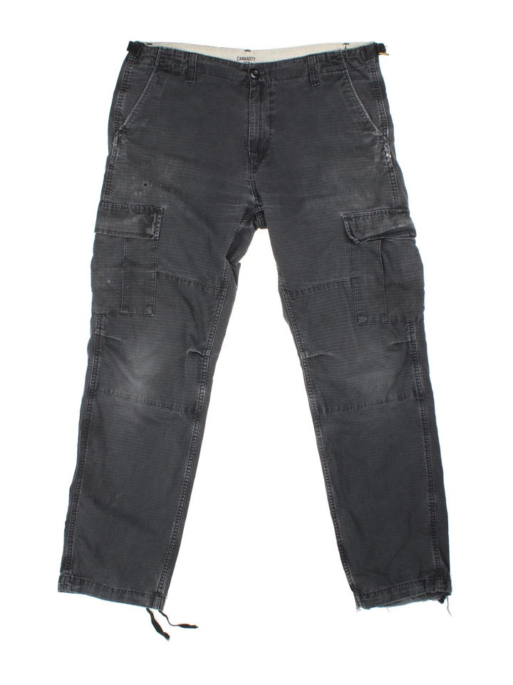 Carhartt Cargo Trousers in a black colourway with multiple pockets and the logo embroidered on the back.