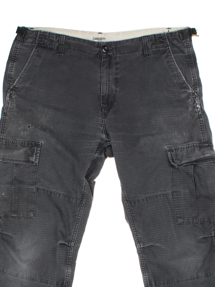 Carhartt Cargo Trousers in a black colourway with multiple pockets and the logo embroidered on the back.