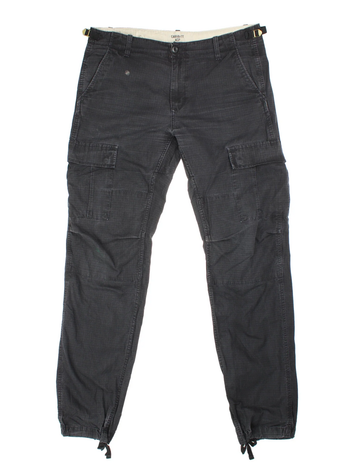 Carhartt Cargo Trousers in a black colourway with multiple pockets and the logo embroidered on the back.