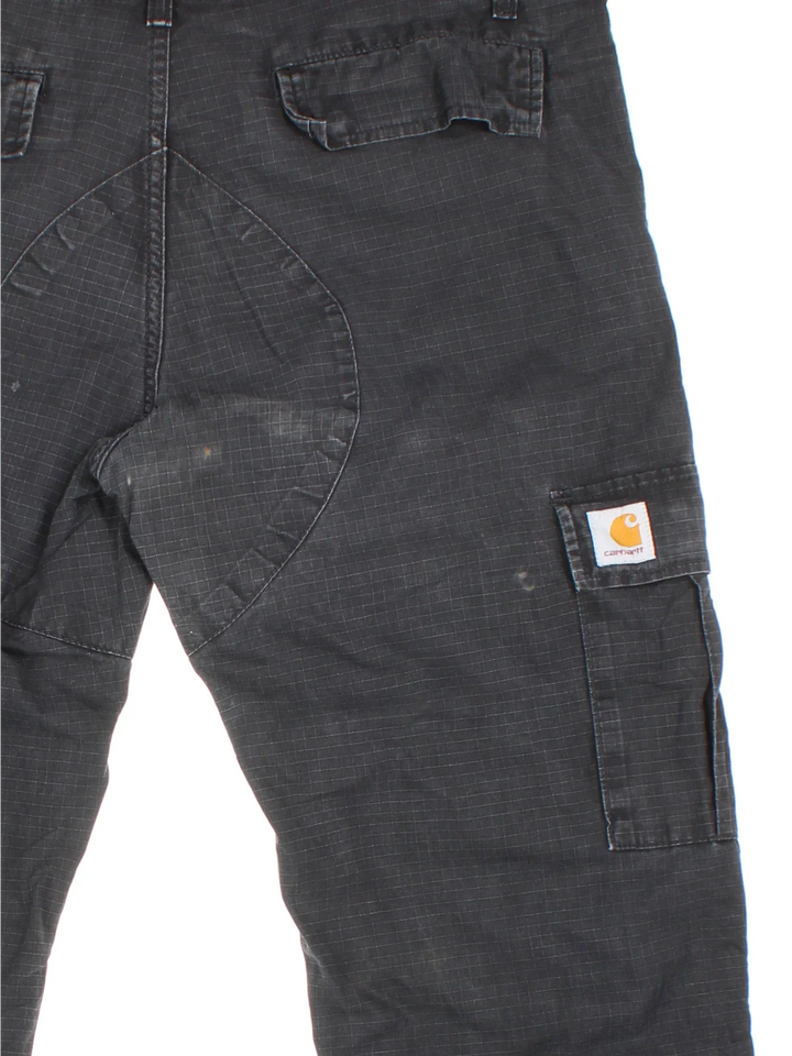 Carhartt Cargo Trousers in a black colourway with multiple pockets and the logo embroidered on the back.