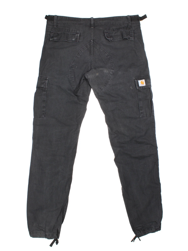 Carhartt Cargo Trousers in a black colourway with multiple pockets and the logo embroidered on the back.