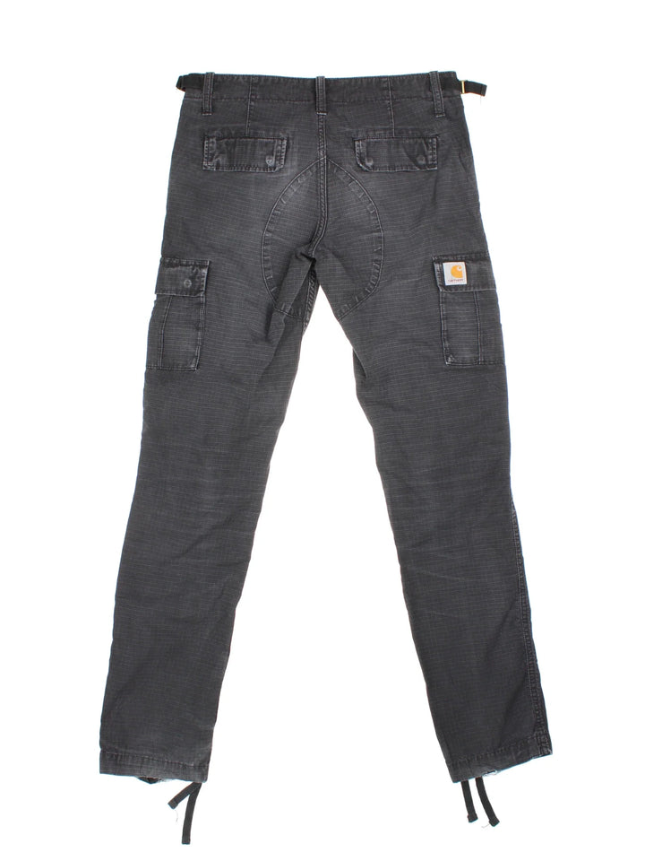 Carhartt Cargo Trousers in a black colourway with multiple pockets and the logo embroidered on the back.
