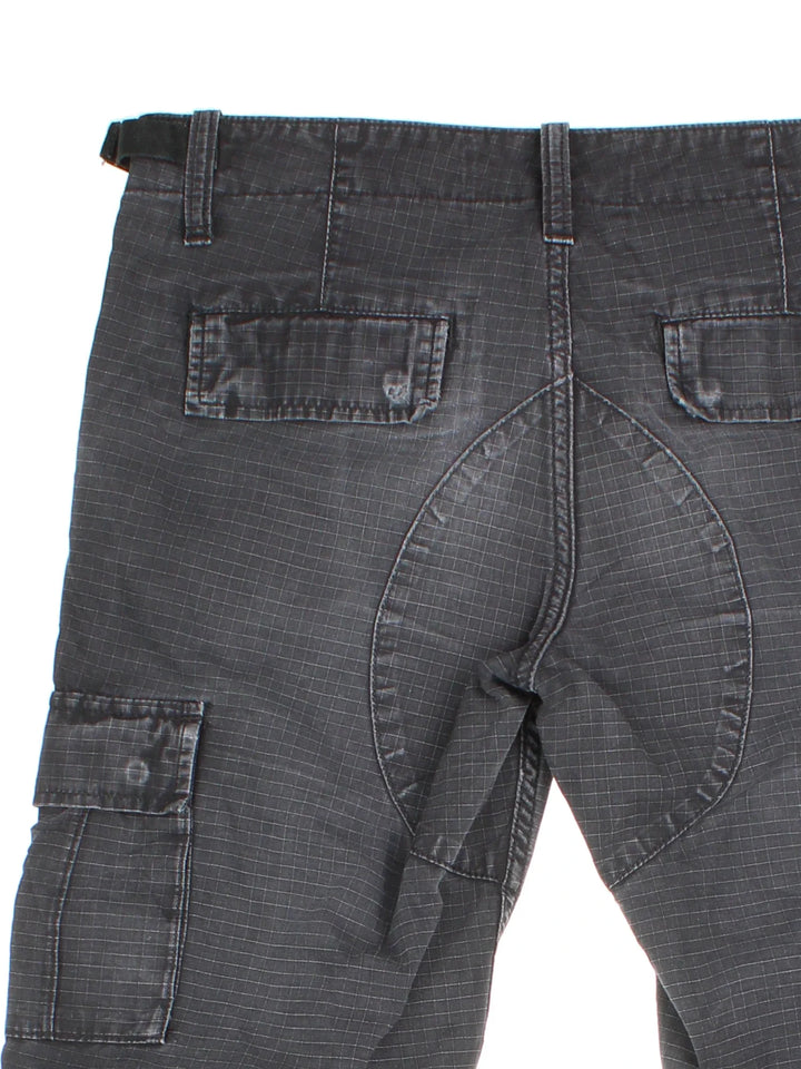 Carhartt Cargo Trousers in a black colourway with multiple pockets and the logo embroidered on the back.