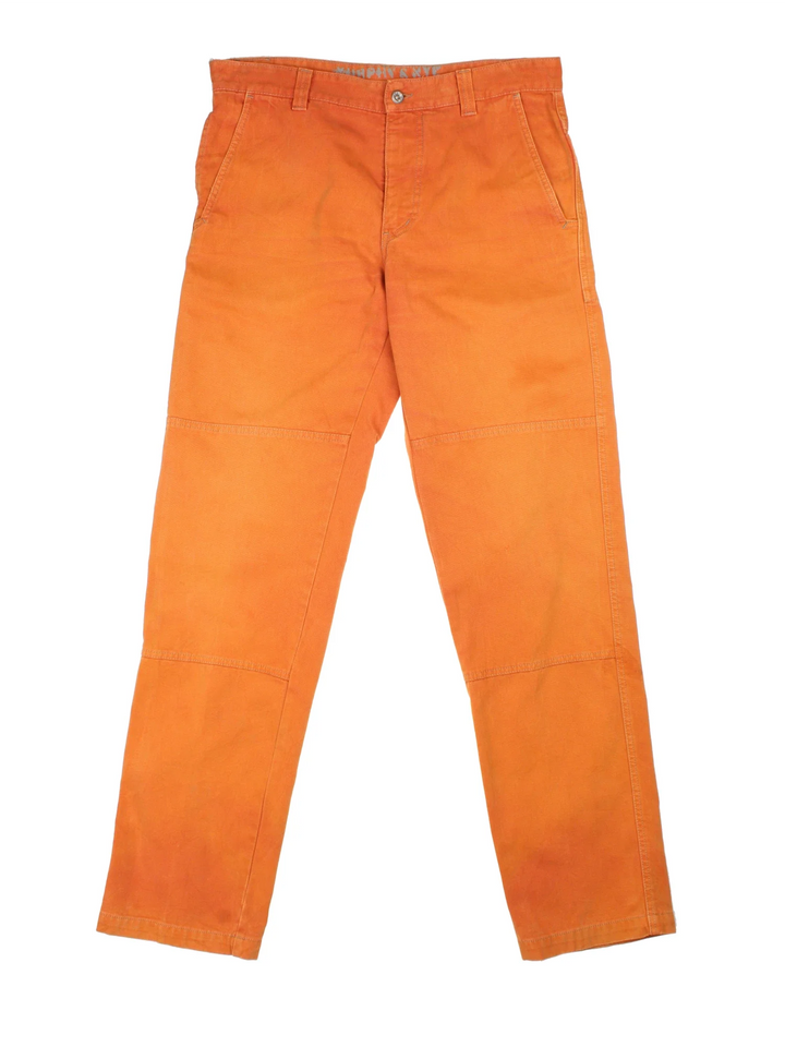 Vintage Double Knee Workwear Trousers in a sun burnt orange colourway with multiple pockets and has a Carhartt logo embroidered on the back - however please note these are not Carhartt but has been stitched on.