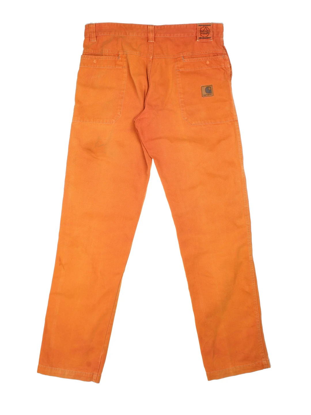 Vintage Double Knee Workwear Trousers in a sun burnt orange colourway with multiple pockets and has a Carhartt logo embroidered on the back - however please note these are not Carhartt but has been stitched on.