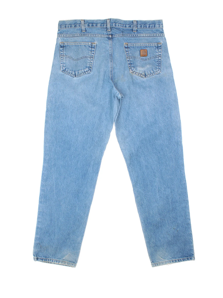 Carhartt Jeans in a blue colourway with multiple pockets and the logo embroidered on the back.
