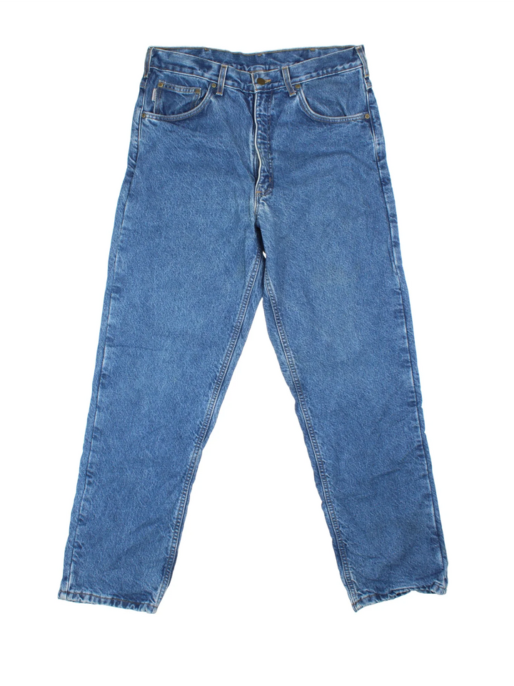 Carhartt Jeans in a blue colourway with multiple pockets, plaid pattern lining and the logo embroidered on the back.