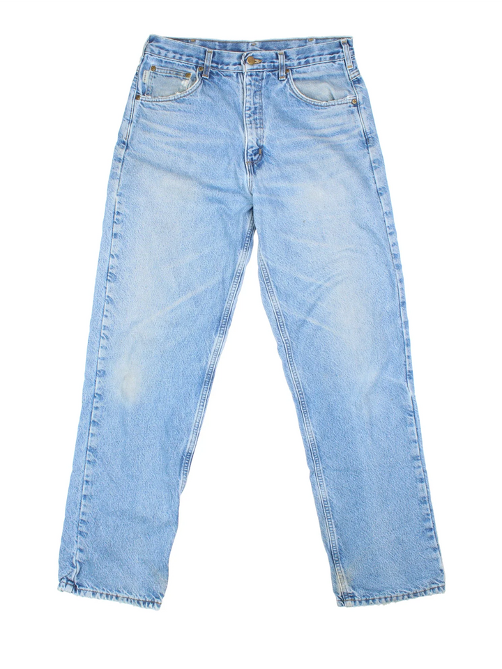 Carhartt Jeans in a blue colourway with multiple pockets, plaid pattern lining and the logo embroidered on the back.
