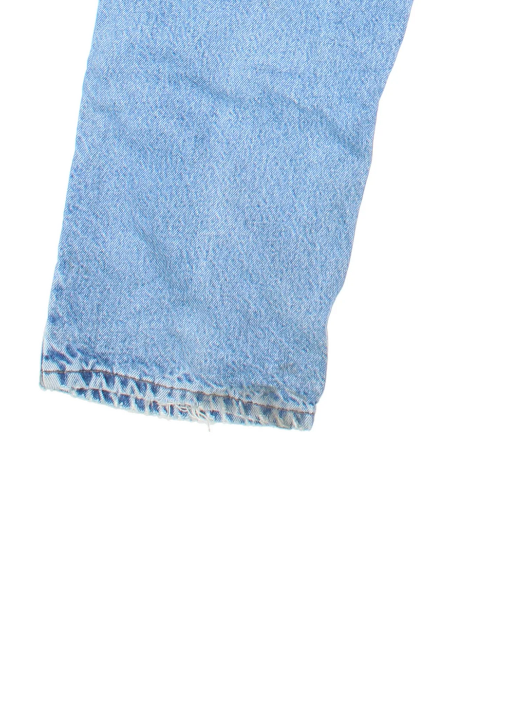 Carhartt Jeans in a blue colourway with multiple pockets, plaid pattern lining and the logo embroidered on the back.