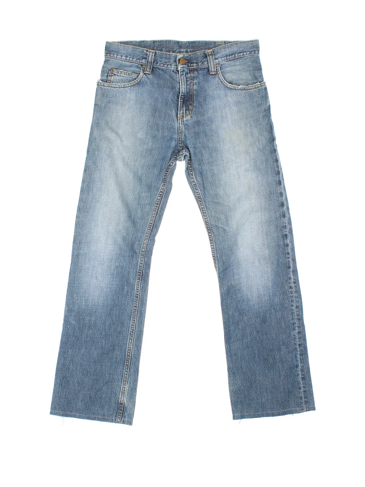 Carhartt Rockin Pant Jeans in a blue colourway with multiple pockets and the logo embroidered on the back.