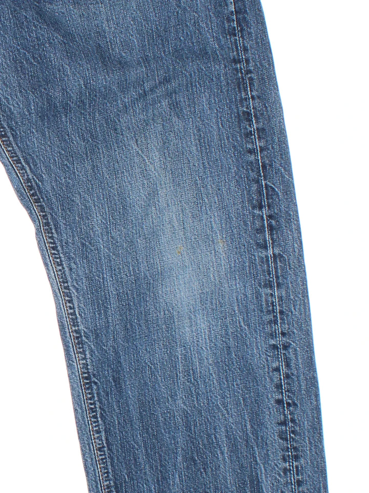 Carhartt Bronco Pant Jeans in a blue colourway with multiple pockets and the logo embroidered on the back.