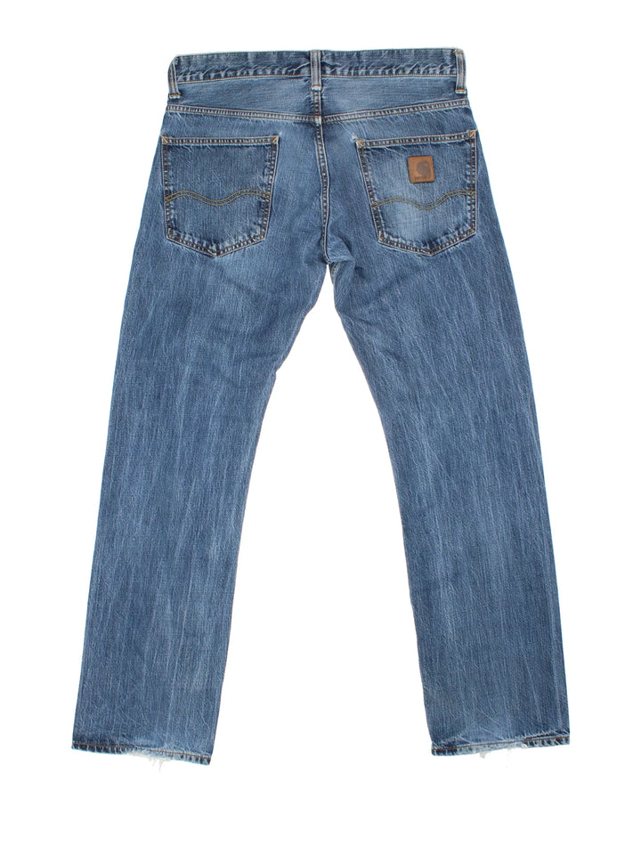 Carhartt Bronco Pant Jeans in a blue colourway with multiple pockets and the logo embroidered on the back.