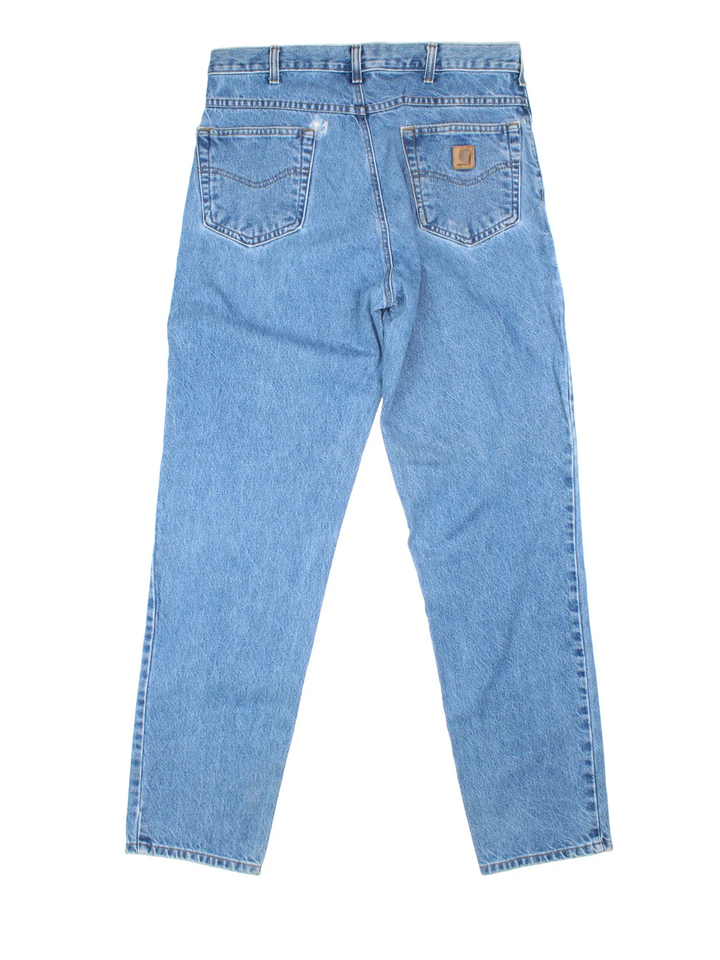 Carhartt Jeans in a blue colourway with multiple pockets and the logo embroidered on the back.