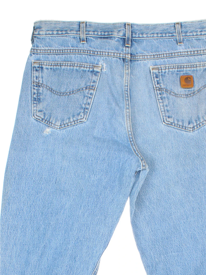 Carhartt Jeans in a blue colourway with multiple pockets and the logo embroidered on the back.