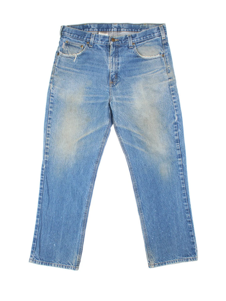 Carhartt Jeans in a blue colourway with multiple pockets and the logo embroidered on the back.