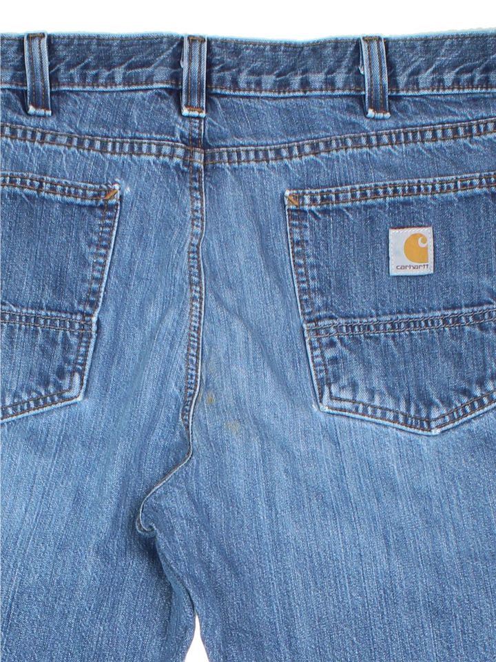 Carhartt Jeans in a blue colourway with multiple pockets and the logo embroidered on the back.
