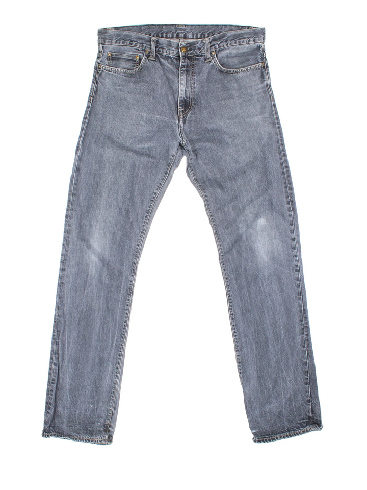 Carhartt Davies Pant Jeans in a grey colourway with multiple pockets and the logo embroidered on the back.