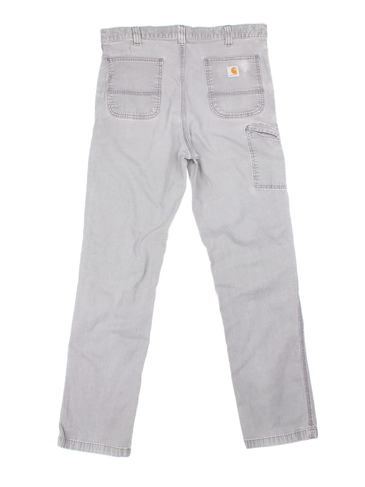 Carhartt Carpenter Jeans in a grey colourway with multiple pockets and the logo embroidered on the back.