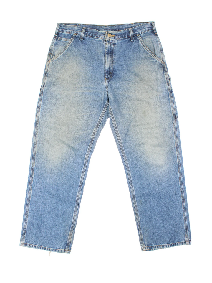 Carhartt Carpenter Jeans in a blue colourway with multiple pockets and the logo embroidered on the back.