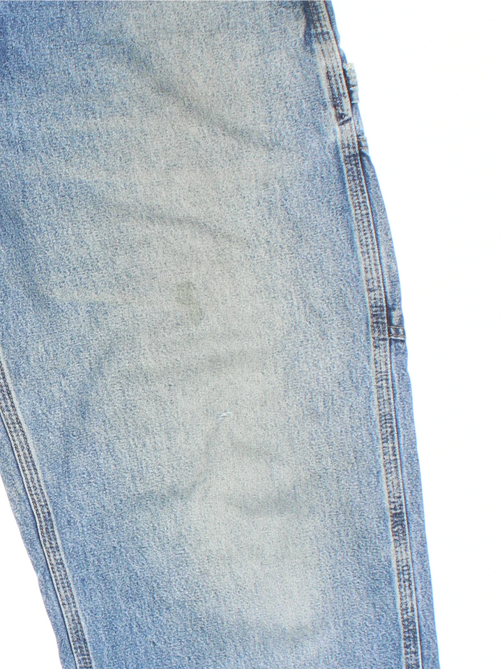Carhartt Carpenter Jeans in a blue colourway with multiple pockets and the logo embroidered on the back.