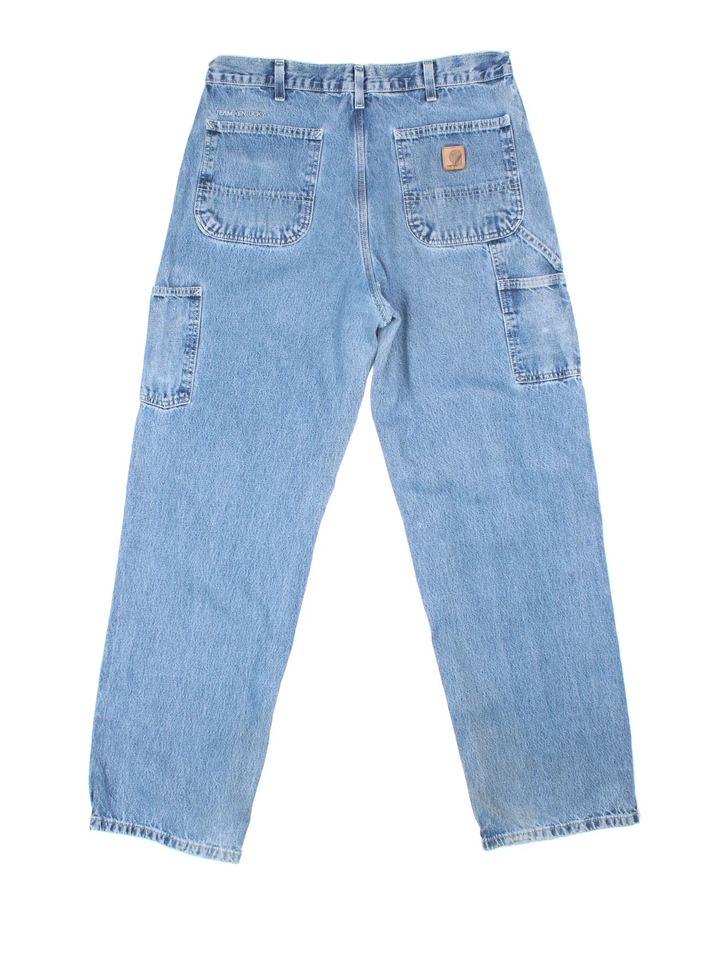 Carhartt Jeans in a blue colourway with multiple pockets and the logo embroidered on the back.