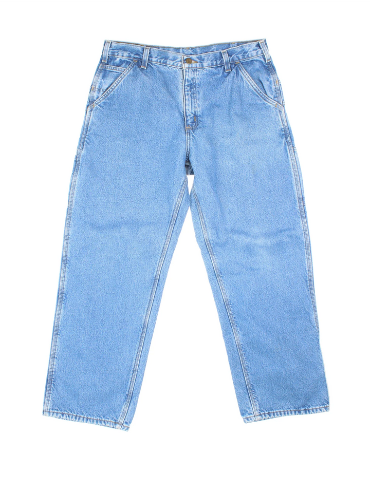 Carhartt Thermal Lined Carpenter Jeans in a blue colourway with multiple pockets and the logo embroidered on the back.
