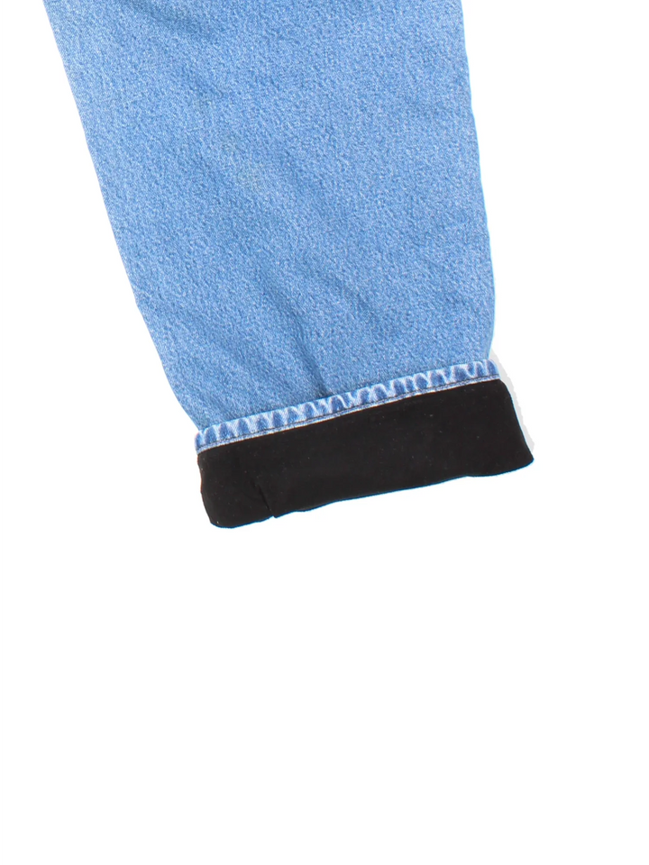 Carhartt Thermal Lined Carpenter Jeans in a blue colourway with multiple pockets and the logo embroidered on the back.