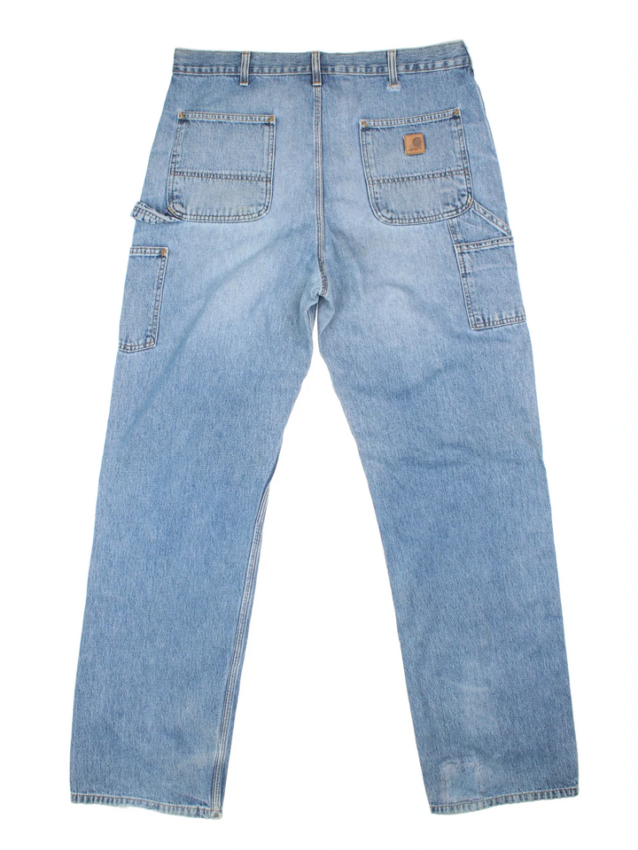 Carhartt Carpenter Jeans in a blue colourway with multiple pockets and the logo embroidered on the back.