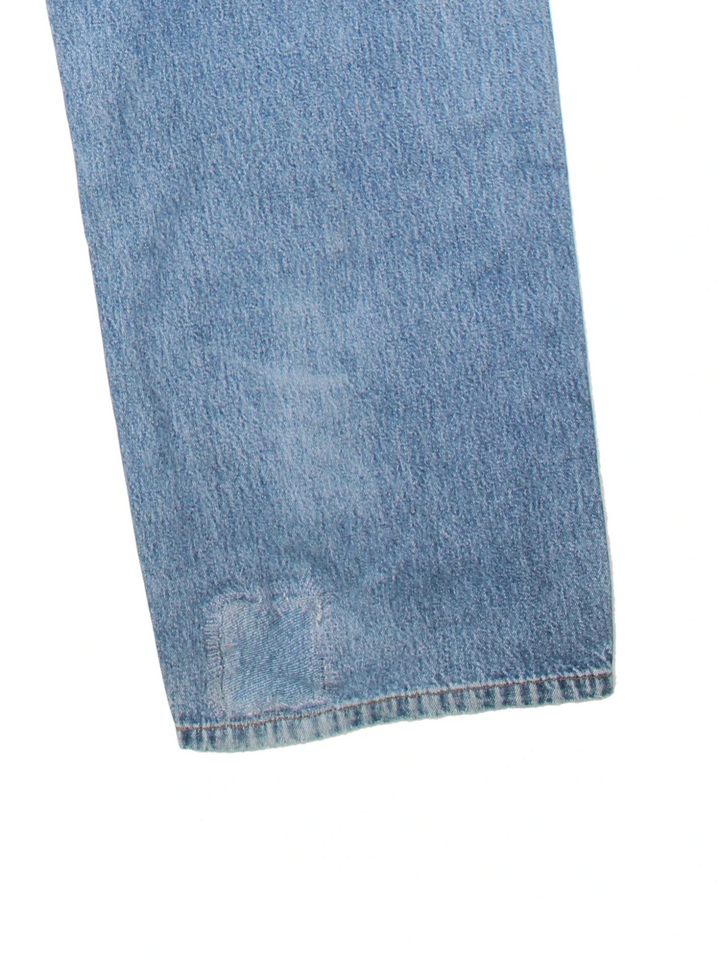 Carhartt Carpenter Jeans in a blue colourway with multiple pockets and the logo embroidered on the back.