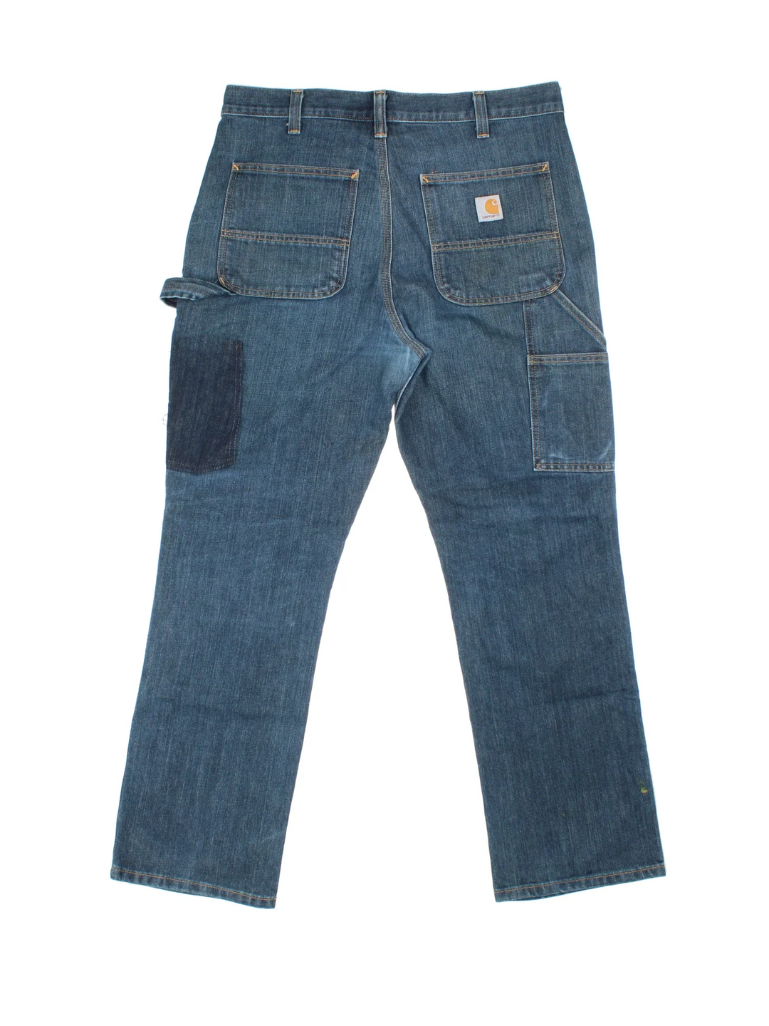 Carhartt Double Knee Jeans in a blue colourway with multiple pockets and the logo embroidered on the back.