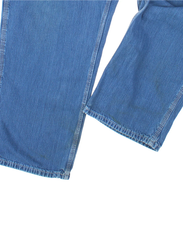 Carhartt Carpenter Jeans in a blue colourway with multiple pockets and the logo embroidered on the back.