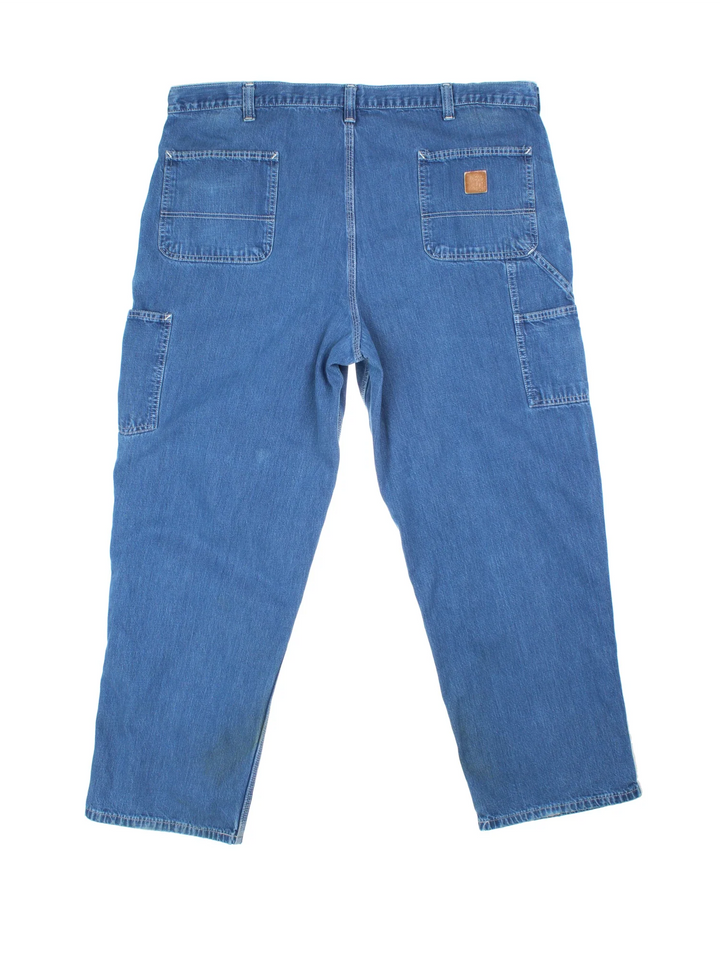 Carhartt Carpenter Jeans in a blue colourway with multiple pockets and the logo embroidered on the back.
