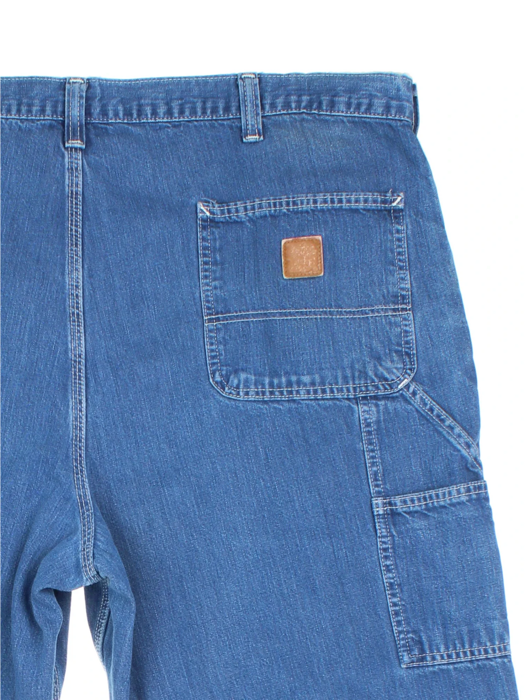 Carhartt Carpenter Jeans in a blue colourway with multiple pockets and the logo embroidered on the back.