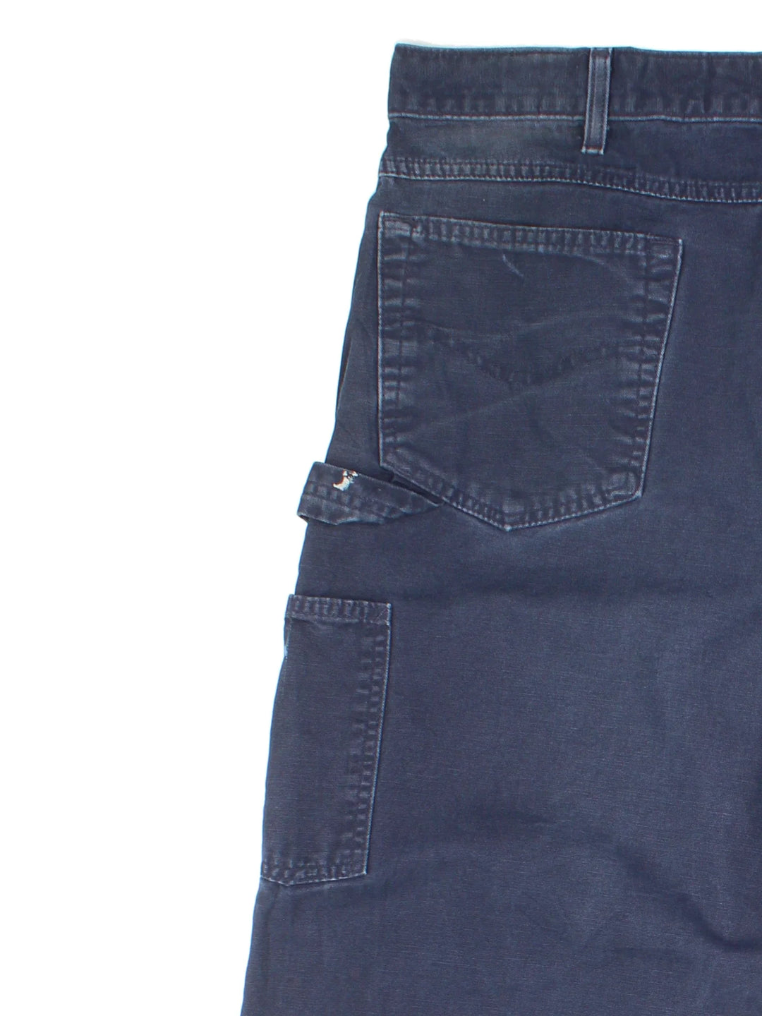 Carhartt Carpenter Trousers in a blue colourway with multiple pockets and the logo embroidered on the back.