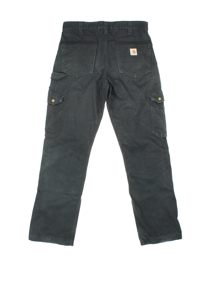Carhartt Cargo Trousers in a black colourway with multiple pockets and the logo embroidered on the back.