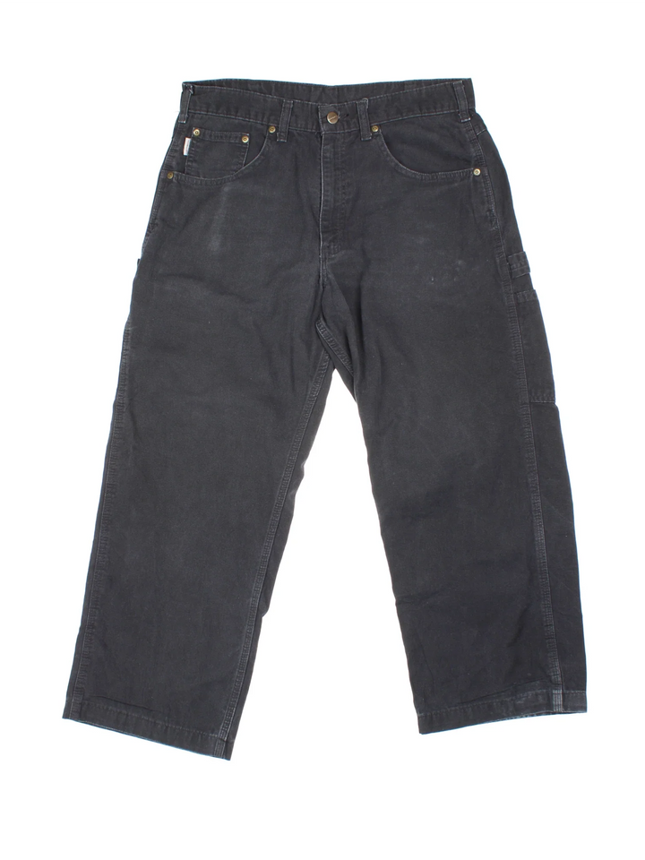 Carhartt Carpenter Trousers in a black colourway with multiple pockets and the logo embroidered on the back.