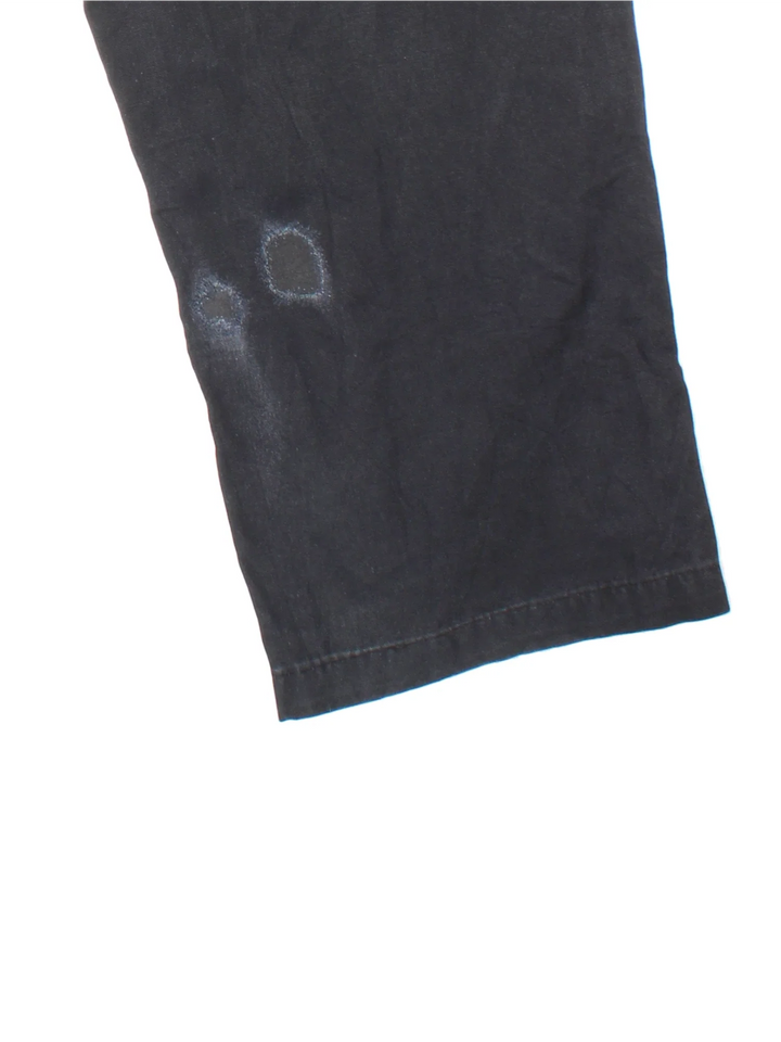 Carhartt Carpenter Trousers in a black colourway with multiple pockets and the logo embroidered on the back.