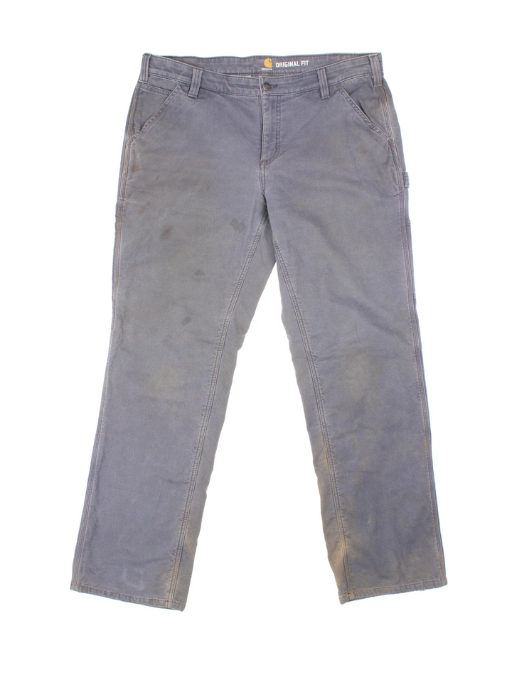 Carhartt Fleece Lined Carpenter Jeans in a grey colourway with multiple pockets and the logo embroidered on the back.